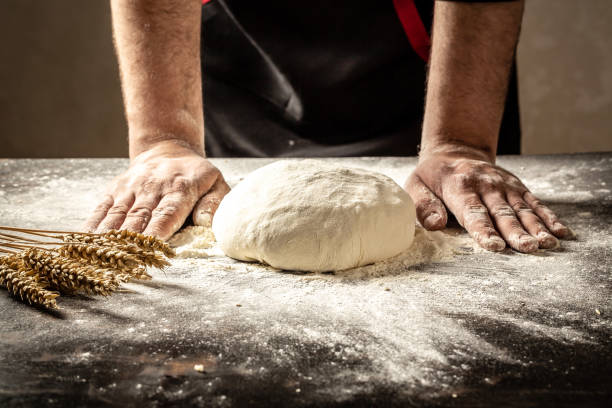 istock men's hands knead the dough bread, pasta or pizza 1220666219
