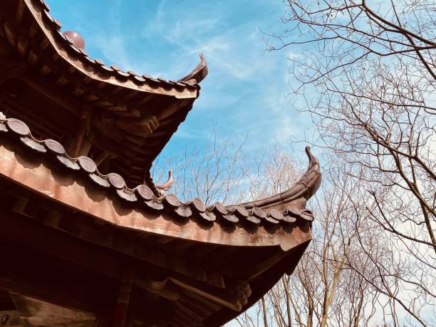 istock Stone arch in the temple, Classical Chinese temple view with Sakura trees in Spring. 1220670066