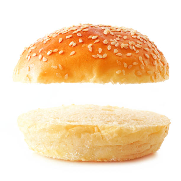 istock Open sesame seed hamburger bun on a white background with copy space 1220670238