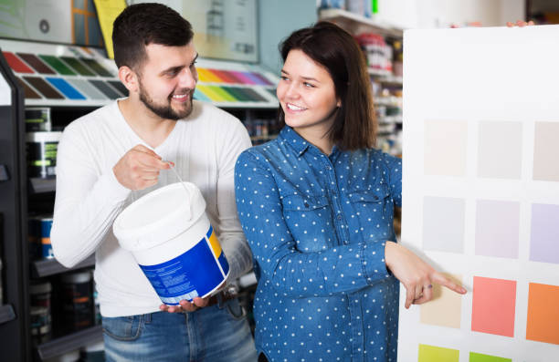 istock Couple in paint supplies store 1220671128