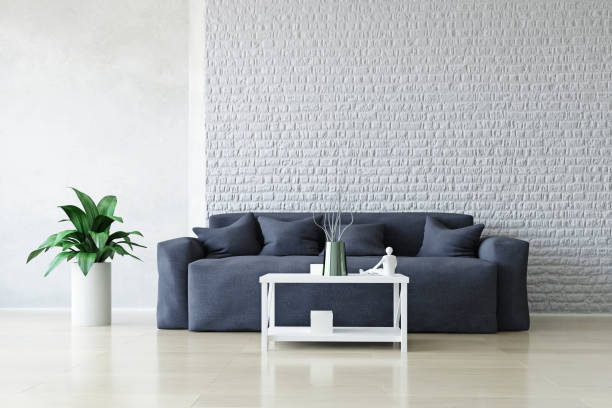 Modern Interior Room with Sofa and Table near the Brick Wall.