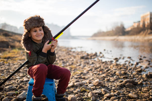 istock A cute boy fishing 1220677398
