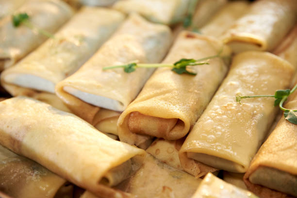 istock Lots of fried pancakes wrapped with stuffing 1220679170