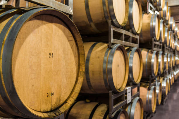 istock Oak wine barrels for wine fermentation at a winery 1220684380