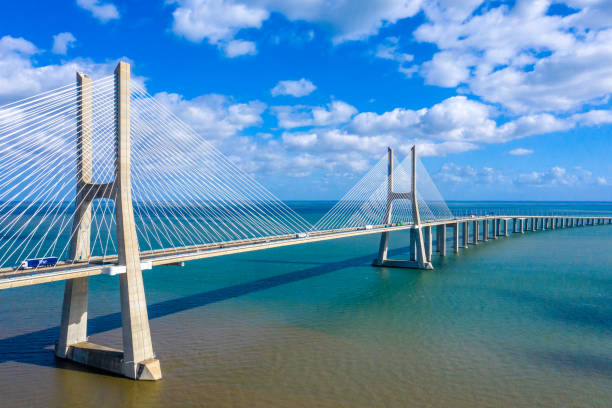 istock Famous Vasco da Gama Bridge over River Tejo in Lisbon from above 1220685109