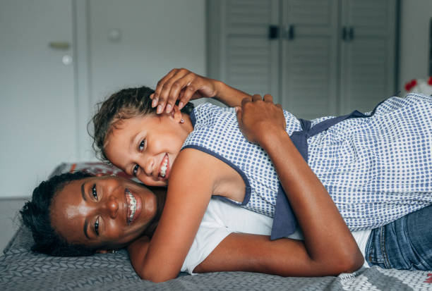 istock Affectionate mother and daughter embracing at home. 1220685242