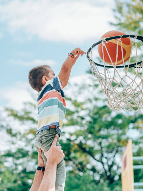istock Father and son playing basketball 1220685247