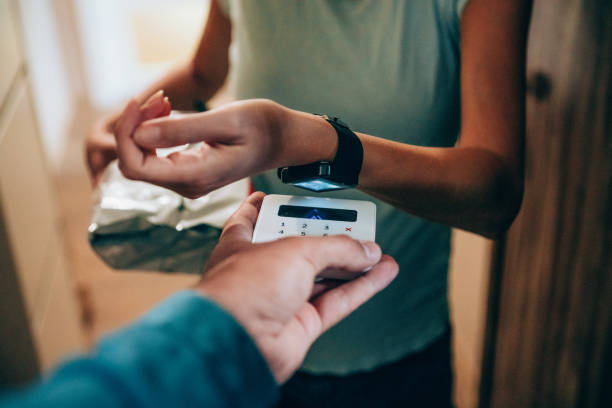 Woman paying contactless with smartwatch