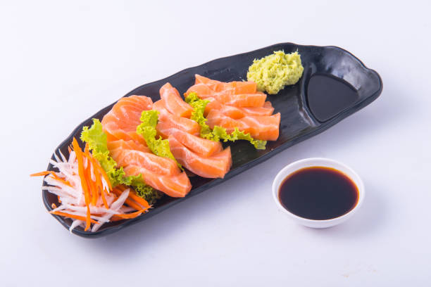istock Sasimi salmon on white background at restaurant. 1220686021