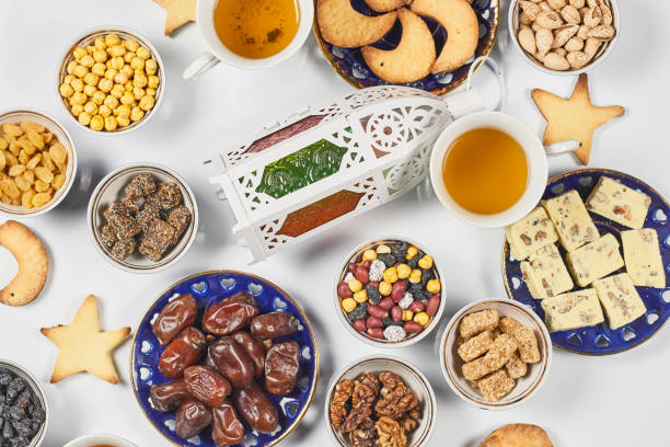 istock Iftar foods on white table. Traditional middle-eastern lunch with cookies and sweets 1220689716