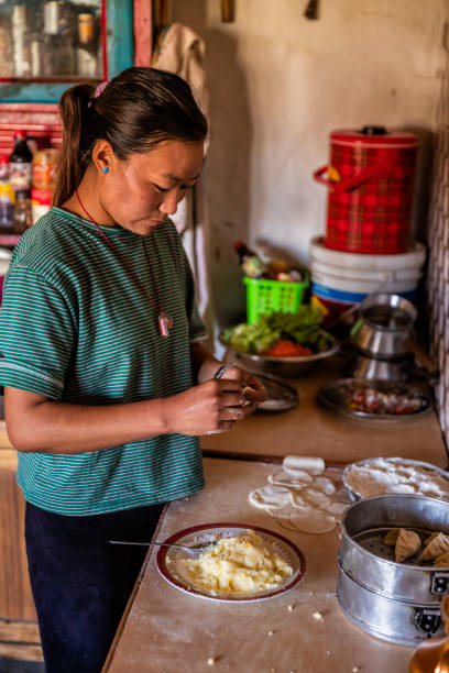 istock Tibetan woman preparing making momos, Upper Mustang, Nepal 1220690501