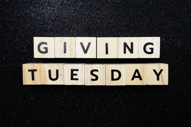 istock Giving Tuesday alphabet letter on black glitter background 1220691835