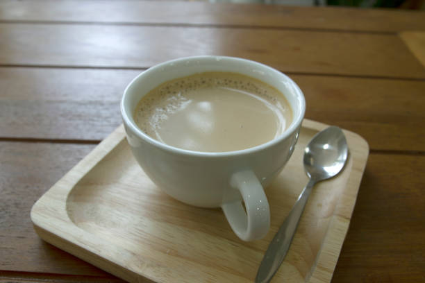 istock Coffee in a white mug on a wooden table 1220692568