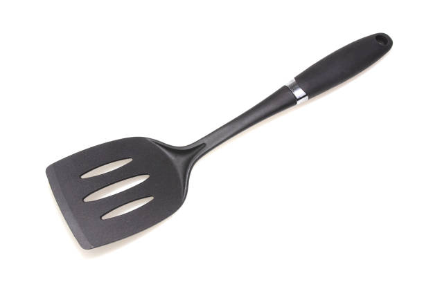istock Plastic black spatula for a frying pan isolated on white background. 1220692690