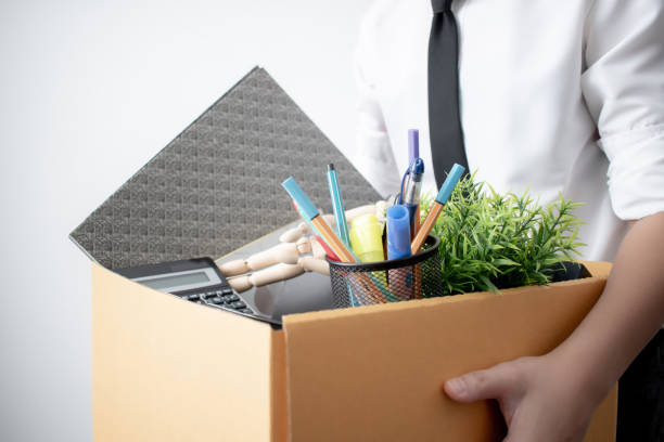 istock Fired from work. The picture of a business man with a box on a white background. 1220693587