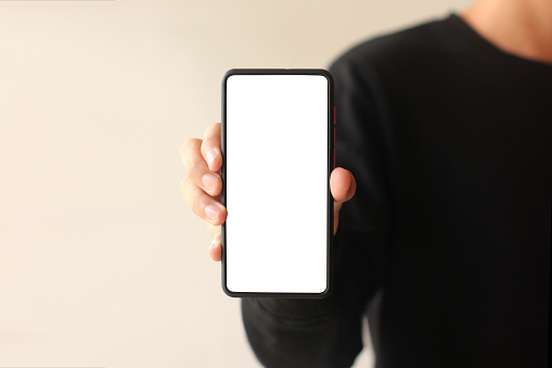 Man hand holding modern smartphone background, mock-up smartphone