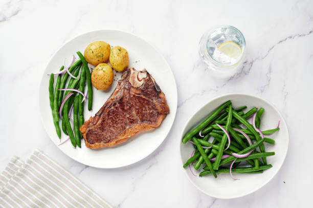 istock Dry Aged Beef Steak with potatoes and green beans. 1220697316