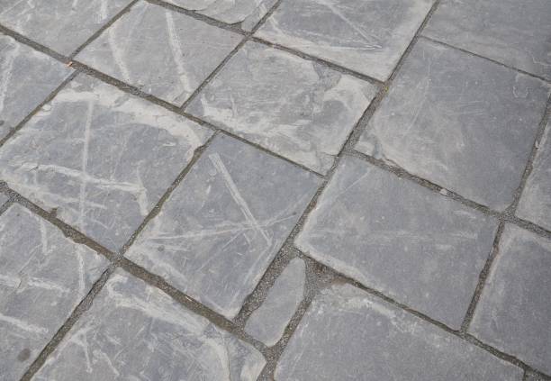 istock grey stone tiles on ground or floor 1220698281
