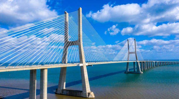 istock Famous Vasco da Gama Bridge over River Tejo in Lisbon from above 1220699876