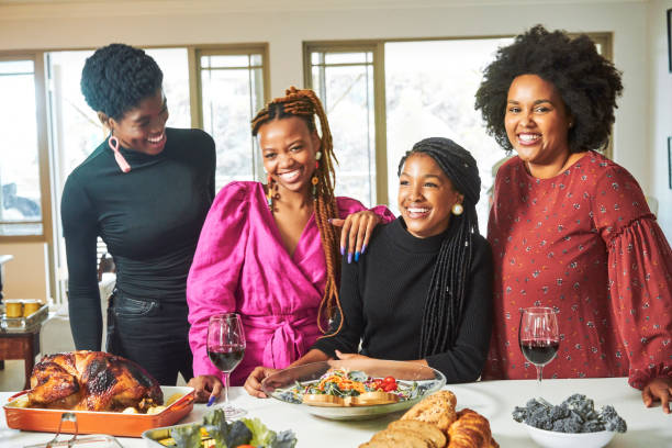 istock Happy friends having fun at dining table in party 1220699897