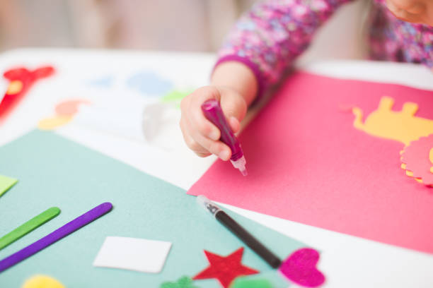 istock toddler girl  making craft for homeschooling 1220701351