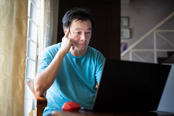 istock Asian adult working from home 1220702602