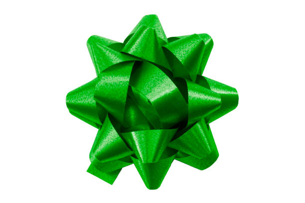 istock Shining anniversary gift and present decorating silky ornament concept with green sleek polished glossy bow isolated on white background clipping path cutout 1220704503