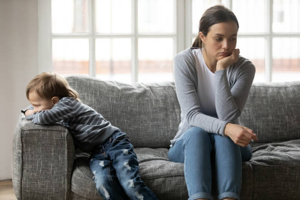 istock Young mom and little son not talking after misunderstanding 1220704516