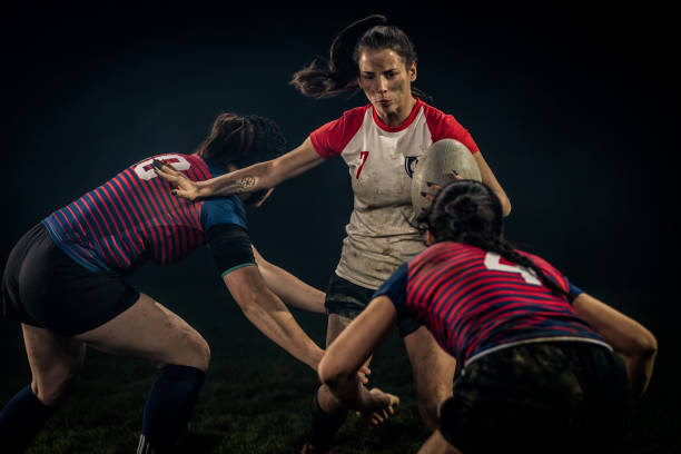 istock Female rugby player running with the ball 1220705347