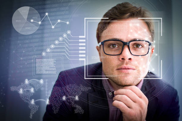 istock Businessman in eyeglasses and virtual identification graphics 1220705373