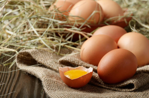 istock Fresh brown organic chicken eggs on wooden table and hemp burlap 1220706356