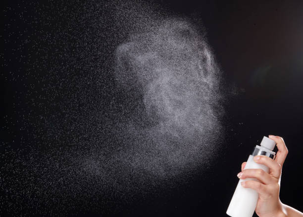 istock a spray of liquid in a black background. 1220707729
