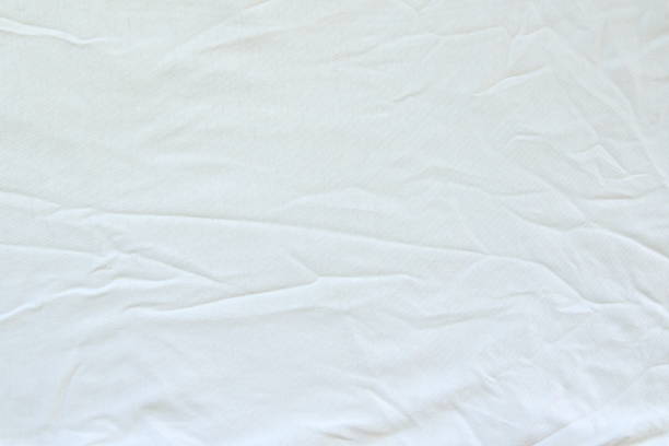 istock Crumpled white linen fabric cotton for wallpaper design 1220707854
