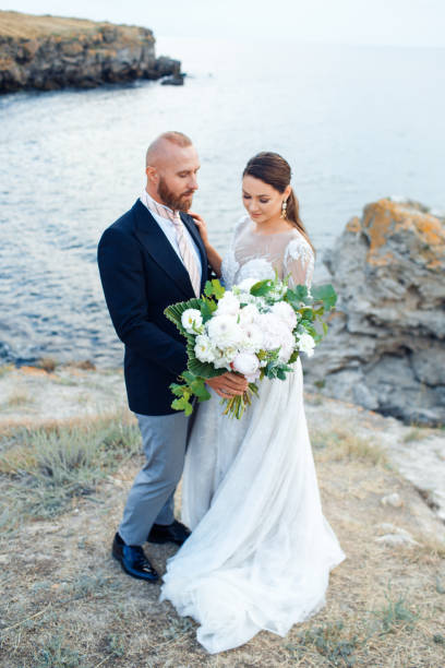 istock Wedding couple by the sea in boho style. 1220708253