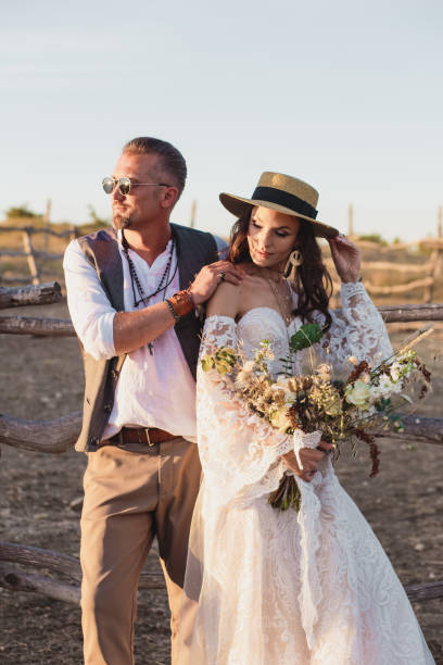 istock Wedding couple in the boho style on the ranch. Designer wedding bouquet. 1220708806