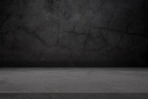 istock Empty black stone marble table top and black stone background from interior office building background 1220709201