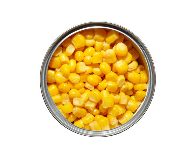 istock Canned pickled corn isolated on white background.The sweet corn in can,top view 1220709263
