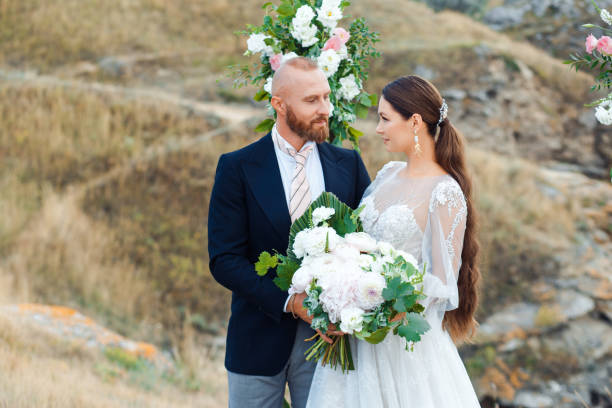 istock Wedding couple by the sea in boho style. 1220709984