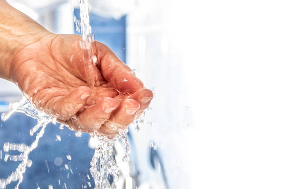 istock Hand in the stream of water. 1220711152