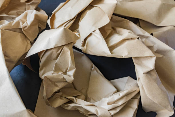 istock Crubpled wrapping paper for recycle. Garbage from delivery goods package. Save the planet 1220711213