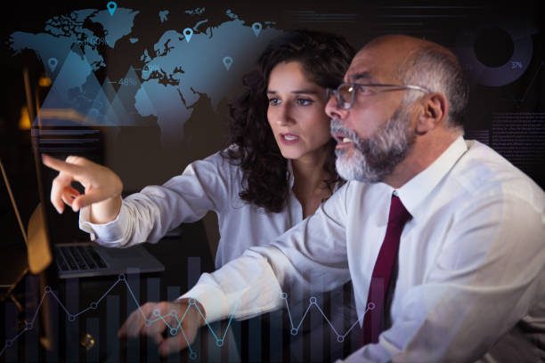 istock Businessman and businesswoman working with computer 1220711289