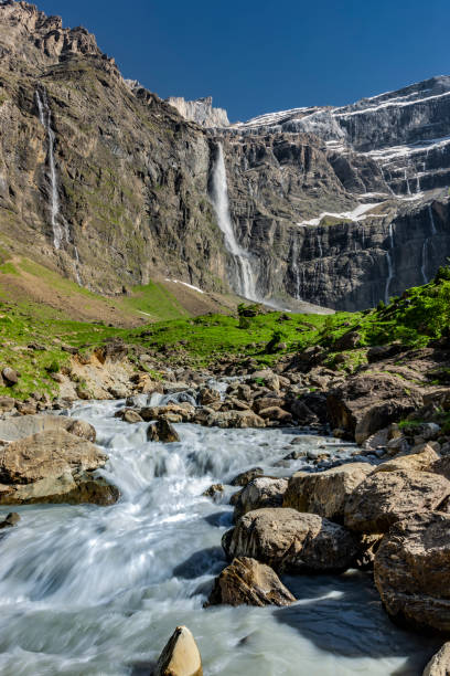 Large waterfall in the Cirque de Gavarnie, Pyrenees National Park, France Large waterfall in the Cirque de Gavarnie, Pyrenees National Park, France gavarnie stock pictures, royalty-free photos & images