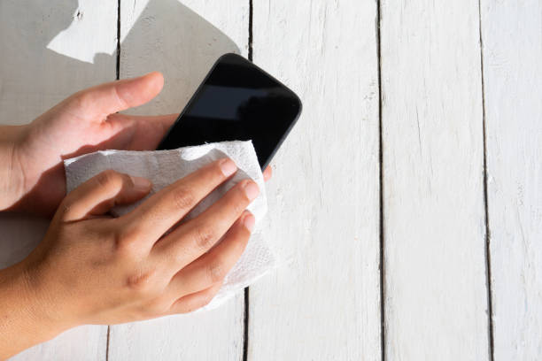 istock cleaning mobile with paper towel on white background 1220712453