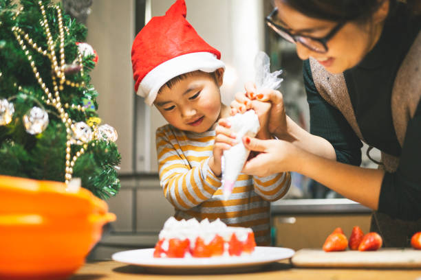 istock Mother and son making Christmas cake together 1220712458