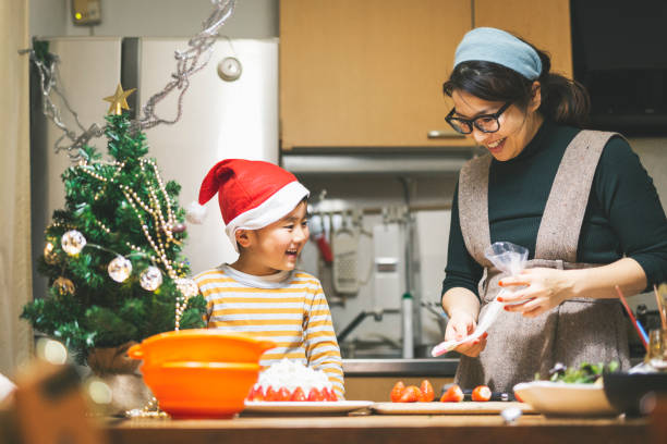 istock Mother and son making Christmas cake together 1220712464