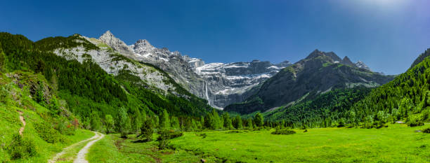 Large waterfall in the Cirque de Gavarnie, Pyrenees National Park, France Large waterfall in the Cirque de Gavarnie, Pyrenees National Park, France gavarnie stock pictures, royalty-free photos & images