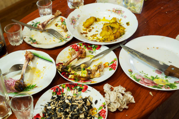 istock dirty dishes on a wooden red table 1220713867