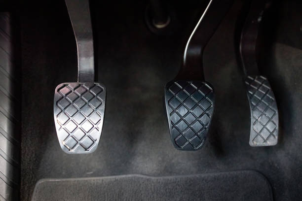 modern luxury car interior element metal gas clutch and brake pedal. sport car with manual gearbox controls. - pedal imagens e fotografias de stock