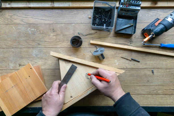 istock build birdhouse, wood, screws and tools lying on the bench 1220717445
