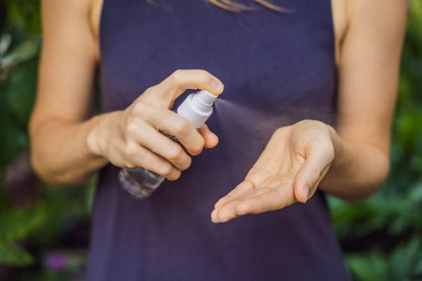 istock Women's hands using wash hand sanitizer gel 1220718530